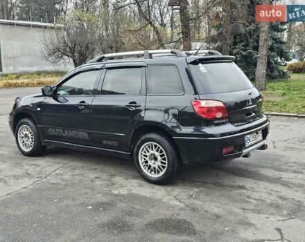 Чорний Міцубісі Аутлендер, об'ємом двигуна 2 л та пробігом 290 тис. км за 5000 $, фото 5 на Automoto.ua