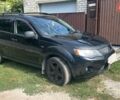 Черный Мицубиси Аутлендер, объемом двигателя 3 л и пробегом 257 тыс. км за 9200 $, фото 1 на Automoto.ua