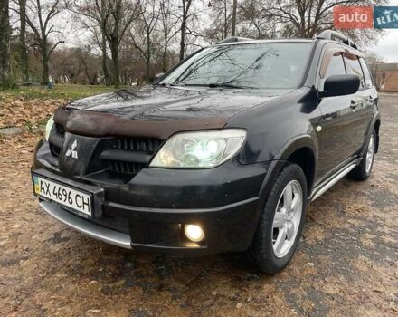 Чорний Міцубісі Аутлендер, об'ємом двигуна 2.4 л та пробігом 213 тис. км за 6850 $, фото 1 на Automoto.ua