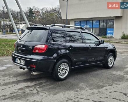 Чорний Міцубісі Аутлендер, об'ємом двигуна 2 л та пробігом 290 тис. км за 4200 $, фото 17 на Automoto.ua