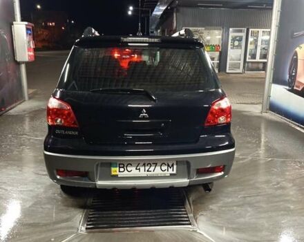 Черный Мицубиси Аутлендер, объемом двигателя 2 л и пробегом 295 тыс. км за 5300 $, фото 3 на Automoto.ua
