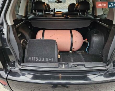 Черный Мицубиси Аутлендер, объемом двигателя 3 л и пробегом 238 тыс. км за 10800 $, фото 22 на Automoto.ua