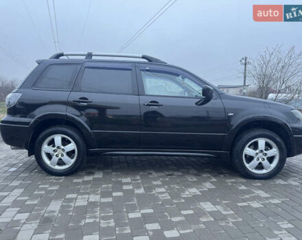 Чорний Міцубісі Аутлендер, об'ємом двигуна 2.38 л та пробігом 202 тис. км за 5800 $, фото 11 на Automoto.ua