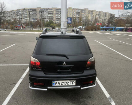 Черный Мицубиси Аутлендер, объемом двигателя 2.38 л и пробегом 314 тыс. км за 5000 $, фото 4 на Automoto.ua