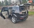 Черный Мицубиси Аутлендер, объемом двигателя 3 л и пробегом 220 тыс. км за 9000 $, фото 2 на Automoto.ua