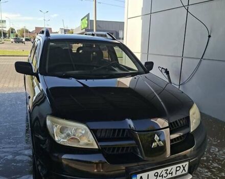 Черный Мицубиси Аутлендер, объемом двигателя 2.4 л и пробегом 270 тыс. км за 6900 $, фото 6 на Automoto.ua
