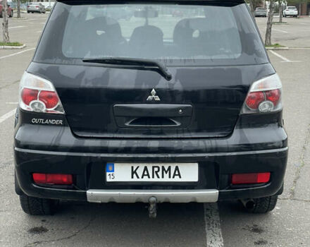 Чорний Міцубісі Аутлендер, об'ємом двигуна 2.38 л та пробігом 198 тис. км за 7100 $, фото 3 на Automoto.ua