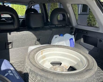 Черный Мицубиси Аутлендер, объемом двигателя 2.38 л и пробегом 310 тыс. км за 7500 $, фото 9 на Automoto.ua