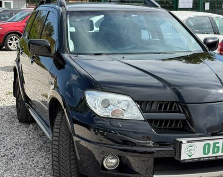 Черный Мицубиси Аутлендер, объемом двигателя 2.4 л и пробегом 258 тыс. км за 6300 $, фото 2 на Automoto.ua