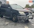 Черный Мицубиси Аутлендер, объемом двигателя 2 л и пробегом 295 тыс. км за 5300 $, фото 9 на Automoto.ua