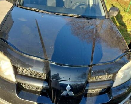 Чорний Міцубісі Аутлендер, об'ємом двигуна 2 л та пробігом 260 тис. км за 5500 $, фото 9 на Automoto.ua