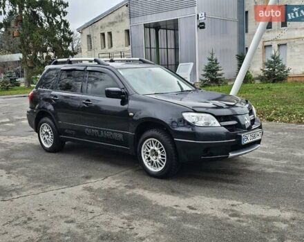 Черный Мицубиси Аутлендер, объемом двигателя 2 л и пробегом 290 тыс. км за 4000 $, фото 6 на Automoto.ua