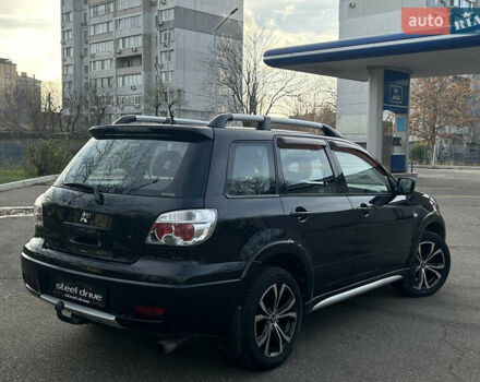 Черный Мицубиси Аутлендер, объемом двигателя 2.4 л и пробегом 320 тыс. км за 5999 $, фото 4 на Automoto.ua