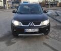 Черный Мицубиси Аутлендер, объемом двигателя 2 л и пробегом 290 тыс. км за 4900 $, фото 1 на Automoto.ua