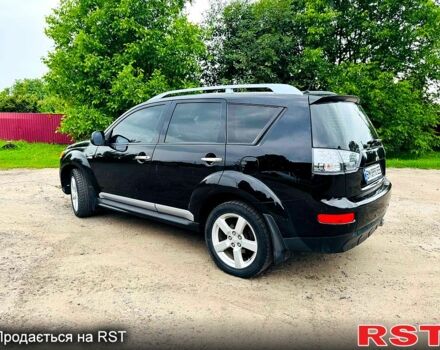 Черный Мицубиси Аутлендер, объемом двигателя 3 л и пробегом 200 тыс. км за 9799 $, фото 2 на Automoto.ua