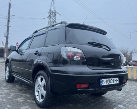 Чорний Міцубісі Аутлендер, об'ємом двигуна 2.4 л та пробігом 202 тис. км за 5800 $, фото 5 на Automoto.ua