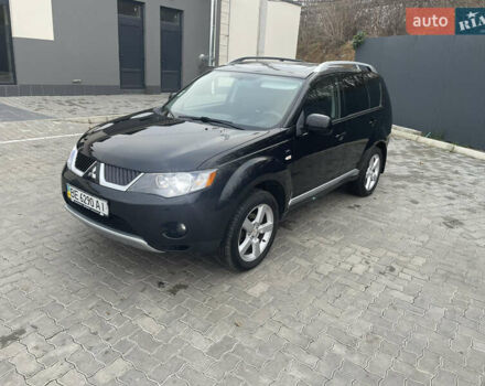 Черный Мицубиси Аутлендер, объемом двигателя 3 л и пробегом 265 тыс. км за 9200 $, фото 1 на Automoto.ua