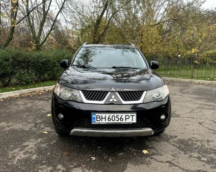 Черный Мицубиси Аутлендер, объемом двигателя 2.4 л и пробегом 230 тыс. км за 8500 $, фото 1 на Automoto.ua