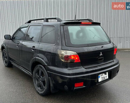 Чорний Міцубісі Аутлендер, об'ємом двигуна 2.38 л та пробігом 175 тис. км за 6000 $, фото 3 на Automoto.ua