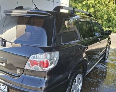 Черный Мицубиси Аутлендер, объемом двигателя 2.4 л и пробегом 270 тыс. км за 6900 $, фото 5 на Automoto.ua