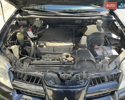 Черный Мицубиси Аутлендер, объемом двигателя 2.38 л и пробегом 310 тыс. км за 7500 $, фото 6 на Automoto.ua