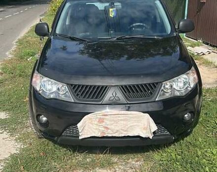 Черный Мицубиси Аутлендер, объемом двигателя 3 л и пробегом 257 тыс. км за 9200 $, фото 1 на Automoto.ua