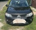 Черный Мицубиси Аутлендер, объемом двигателя 3 л и пробегом 257 тыс. км за 9200 $, фото 1 на Automoto.ua