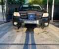 Черный Мицубиси Аутлендер, объемом двигателя 2.4 л и пробегом 219 тыс. км за 6500 $, фото 1 на Automoto.ua