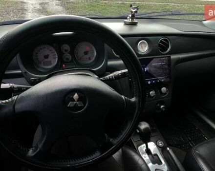 Черный Мицубиси Аутлендер, объемом двигателя 2.38 л и пробегом 215 тыс. км за 5800 $, фото 5 на Automoto.ua