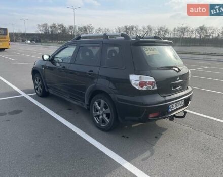 Черный Мицубиси Аутлендер, объемом двигателя 2.38 л и пробегом 180 тыс. км за 6900 $, фото 2 на Automoto.ua