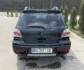 Черный Мицубиси Аутлендер, объемом двигателя 2 л и пробегом 130 тыс. км за 7100 $, фото 4 на Automoto.ua
