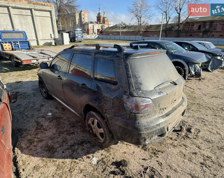 Черный Мицубиси Аутлендер, объемом двигателя 2 л и пробегом 258 тыс. км за 2200 $, фото 6 на Automoto.ua