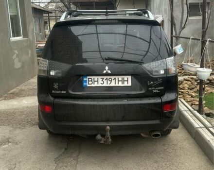 Черный Мицубиси Аутлендер, объемом двигателя 2.4 л и пробегом 240 тыс. км за 8500 $, фото 2 на Automoto.ua