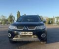 Чорний Міцубісі Аутлендер, об'ємом двигуна 2 л та пробігом 286 тис. км за 5700 $, фото 1 на Automoto.ua