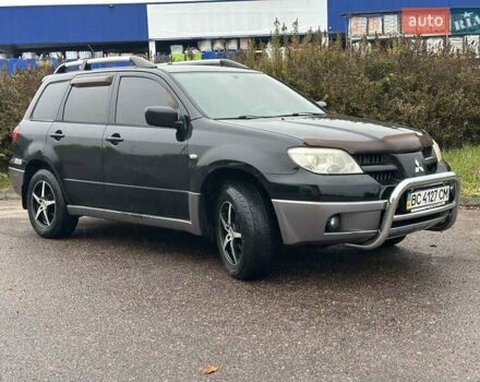 Черный Мицубиси Аутлендер, объемом двигателя 2 л и пробегом 295 тыс. км за 5300 $, фото 11 на Automoto.ua