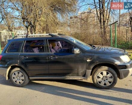 Чорний Міцубісі Аутлендер, об'ємом двигуна 2 л та пробігом 260 тис. км за 5500 $, фото 10 на Automoto.ua