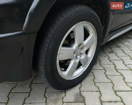 Черный Мицубиси Аутлендер, объемом двигателя 2.4 л и пробегом 248 тыс. км за 7300 $, фото 7 на Automoto.ua