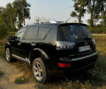 Черный Мицубиси Аутлендер, объемом двигателя 2 л и пробегом 200 тыс. км за 7700 $, фото 3 на Automoto.ua