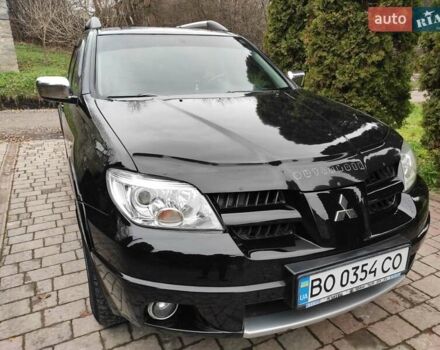 Черный Мицубиси Аутлендер, объемом двигателя 2 л и пробегом 180 тыс. км за 6000 $, фото 3 на Automoto.ua