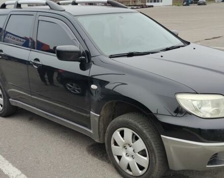 Чорний Міцубісі Аутлендер, об'ємом двигуна 2 л та пробігом 175 тис. км за 7800 $, фото 2 на Automoto.ua