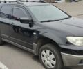 Чорний Міцубісі Аутлендер, об'ємом двигуна 2 л та пробігом 175 тис. км за 7800 $, фото 2 на Automoto.ua