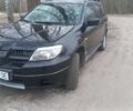Чорний Міцубісі Аутлендер, об'ємом двигуна 2 л та пробігом 245 тис. км за 5400 $, фото 1 на Automoto.ua