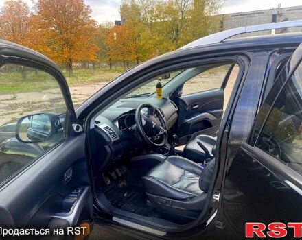 Черный Мицубиси Аутлендер, объемом двигателя 2 л и пробегом 207 тыс. км за 8100 $, фото 7 на Automoto.ua