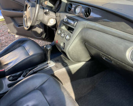 Черный Мицубиси Аутлендер, объемом двигателя 2.38 л и пробегом 118 тыс. км за 6850 $, фото 7 на Automoto.ua