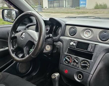 Черный Мицубиси Аутлендер, объемом двигателя 2 л и пробегом 200 тыс. км за 4900 $, фото 6 на Automoto.ua