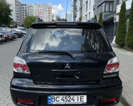 Черный Мицубиси Аутлендер, объемом двигателя 2.38 л и пробегом 310 тыс. км за 7500 $, фото 18 на Automoto.ua