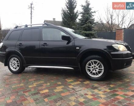 Черный Мицубиси Аутлендер, объемом двигателя 2 л и пробегом 284 тыс. км за 4999 $, фото 11 на Automoto.ua