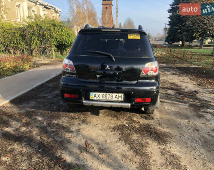 Черный Мицубиси Аутлендер, объемом двигателя 2.4 л и пробегом 260 тыс. км за 7200 $, фото 14 на Automoto.ua
