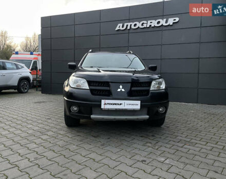 Черный Мицубиси Аутлендер, объемом двигателя 2.4 л и пробегом 248 тыс. км за 7300 $, фото 3 на Automoto.ua