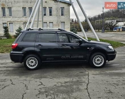 Черный Мицубиси Аутлендер, объемом двигателя 2 л и пробегом 290 тыс. км за 4000 $, фото 10 на Automoto.ua
